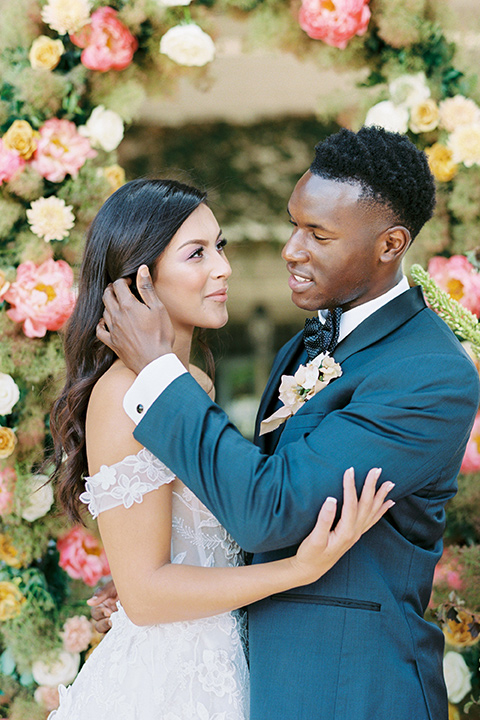  old world garden wedding design with yellow and pink flowers and the groom in a navy shawl tuxedo – ceremony 