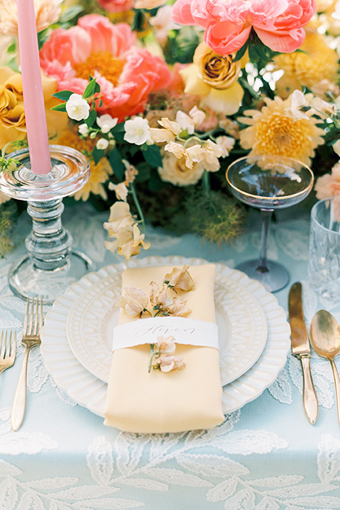  old world garden wedding design with yellow and pink flowers and the groom in a navy shawl tuxedo – ceremony 