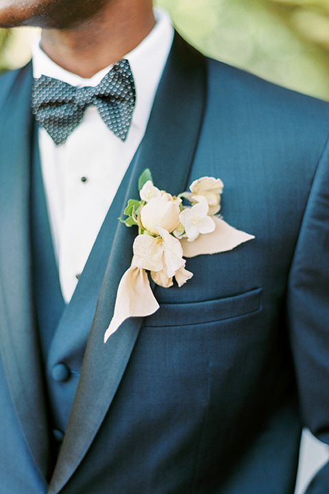  old world garden wedding design with yellow and pink flowers and the groom in a navy shawl tuxedo – ceremony arch 