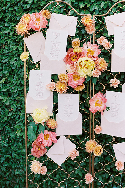  old world garden wedding design with yellow and pink flowers and the groom in a navy shawl tuxedo – ceremony arch 