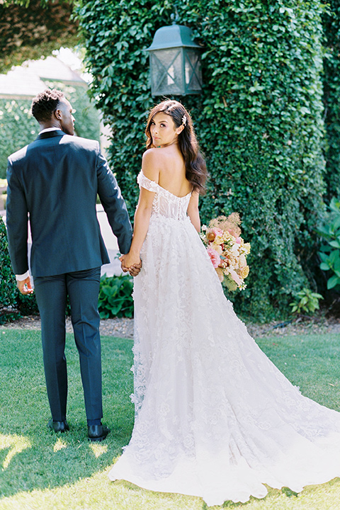  old world garden wedding design with yellow and pink flowers and the groom in a navy shawl tuxedo – ceremony arch 