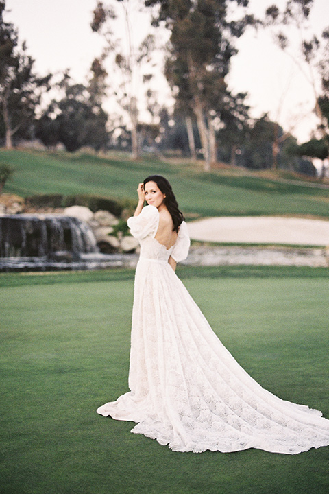  a neutral romantic wedding with touches of peach colors and the groom in a tan suit- bride 