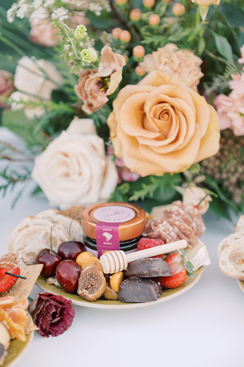  a neutral romantic wedding with touches of peach colors and the groom in a tan suit- bride 