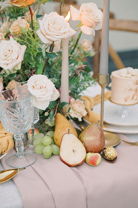  a neutral romantic wedding with touches of peach colors and the groom in a tan suit- bride 