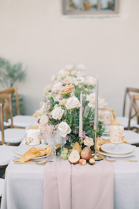  a neutral romantic wedding with touches of peach colors and the groom in a tan suit- invites 