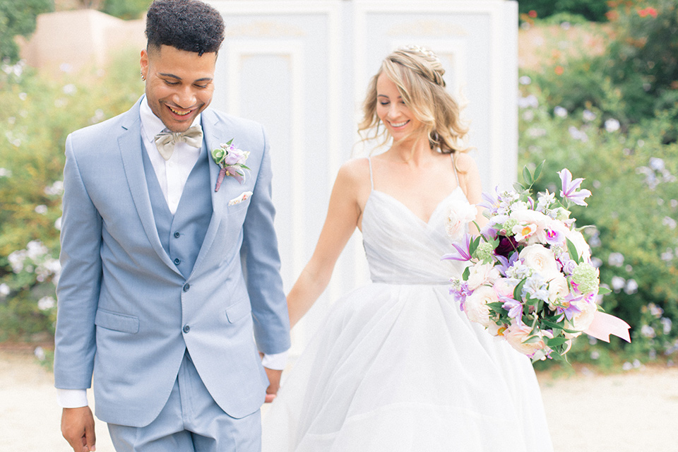  Perfectly Provincial Wedding with baby animals and the bride in a ballgown and the groom in a light blue suit 