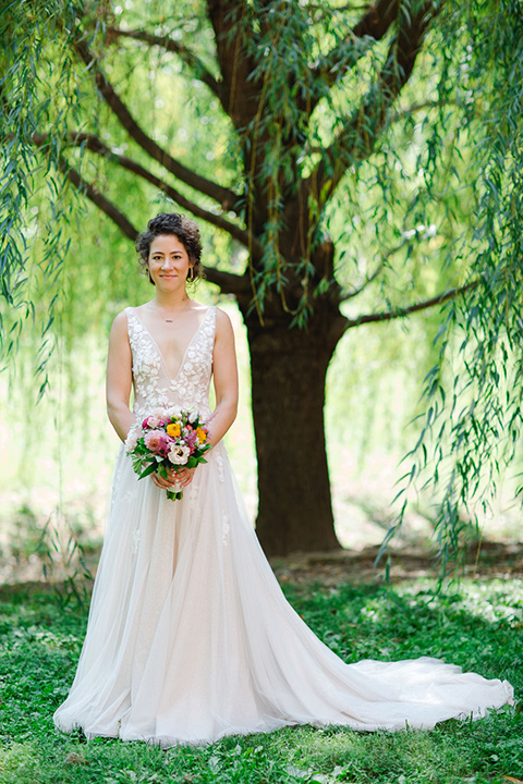  a downtown wedding at the cultural center with the groom and groomsmen in green suits and the bridesmaids in blush dresses and the bride in an a-line gown- bride in her wedding gown