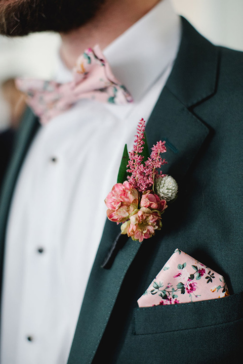  a downtown wedding at the cultural center with the groom and groomsmen in green suits and the bridesmaids in blush dresses and the bride in an a-line gown- close up on grooms suit 