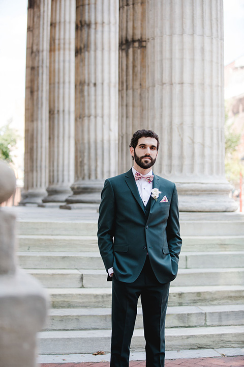  a downtown wedding at the cultural center with the groom and groomsmen in green suits and the bridesmaids in blush dresses and the bride in an a-line gown- groom in suit 