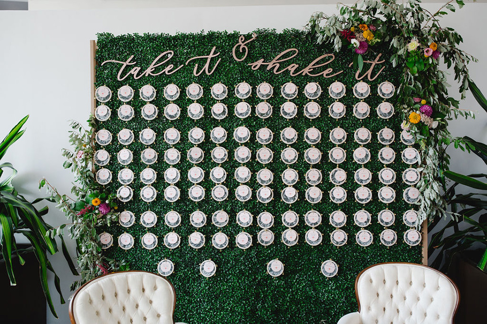  a downtown wedding at the cultural center with the groom and groomsmen in green suits and the bridesmaids in blush dresses and the bride in an a-line gown- seating chart