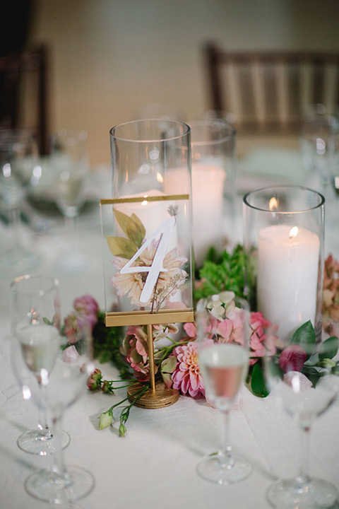  a downtown wedding at the cultural center with the groom and groomsmen in green suits and the bridesmaids in blush dresses and the bride in an a-line gown- reception tables 