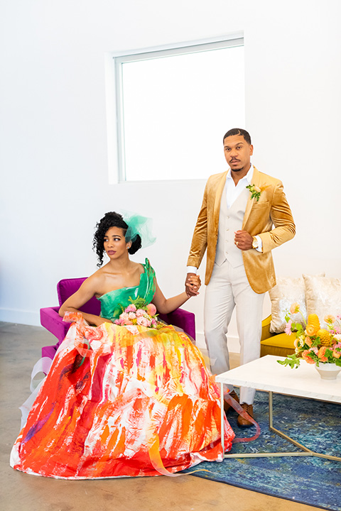  colorful wedding at the forme in LA with a gold velvet jacket and a colorful gown