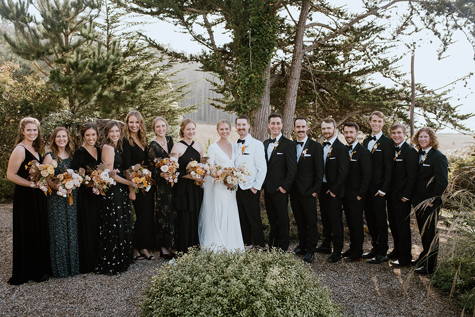  lizzie and tommys wedding on the beach with neutral colors and a gold velvet jacket – bridal party