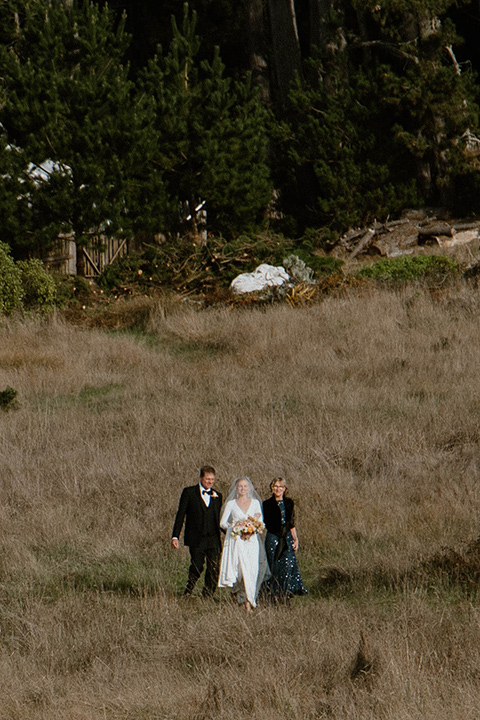  lizzie and tommys wedding on the beach with neutral colors and a gold velvet jacket – bride 