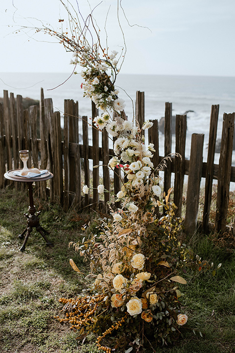  lizzie and tommys wedding on the beach with neutral colors and a gold velvet jacket – ceremony decor