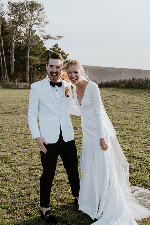  lizzie and tommys wedding on the beach with neutral colors and a gold velvet jacket – embrace 