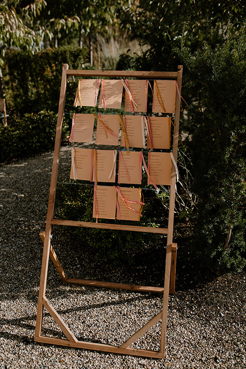  lizzie and tommys wedding on the beach with neutral colors and a gold velvet jacket – bride 