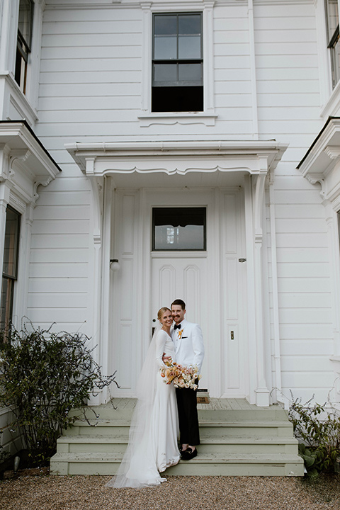  lizzie and tommys wedding on the beach with neutral colors and a gold velvet jacket – bride 