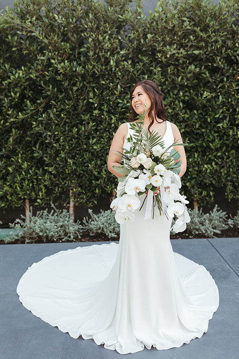  fun and tropical wedding inspired by Bali – the bride in her trendy formfitting gown  