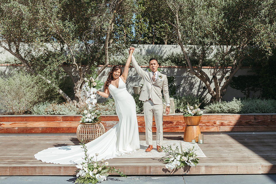  fun and tropical wedding inspired by Bali – couple cheering after i-do  