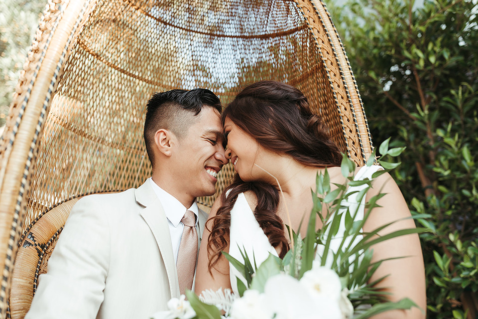  fun and tropical wedding inspired by Bali – couple in chair  