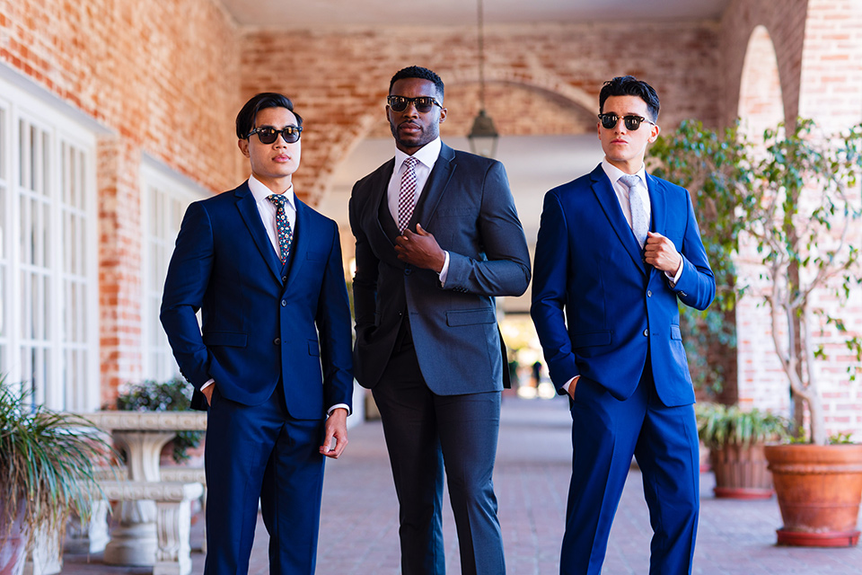  how to rent a suit or tuxedo in vegas three young adult men wearing tuxedos in varying shades of blue 