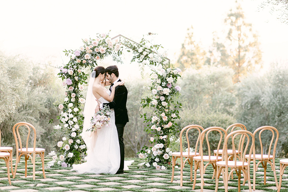  Garden Romance wedding with lush florals and the groom in  multiple looks 