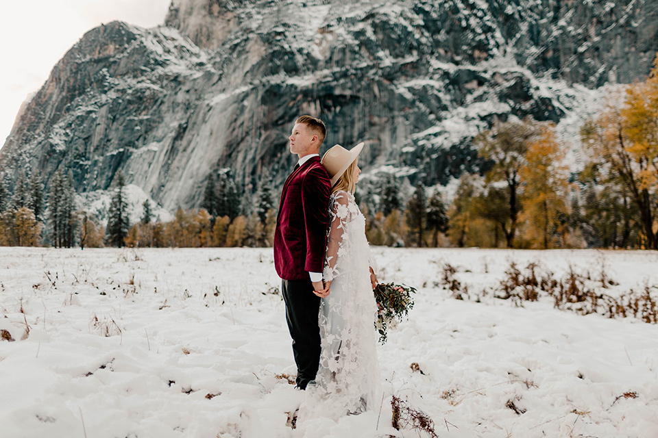  winter Yosemite wedding with the groom in a burgundy velvet tuxedo