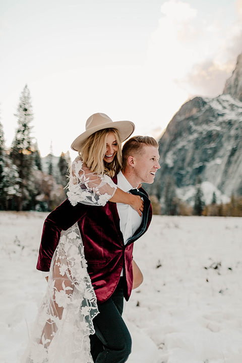  winter Yosemite wedding with the groom in a burgundy velvet tuxedo 