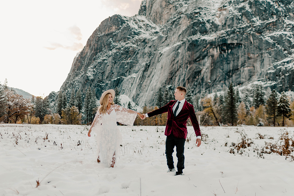  winter Yosemite wedding with the groom in a burgundy velvet tuxedo