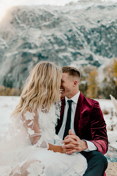  winter Yosemite wedding with the groom in a burgundy velvet tuxedo 