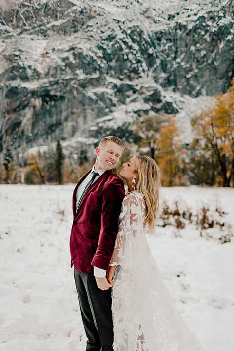  winter Yosemite wedding with the groom in a burgundy velvet tuxedo 