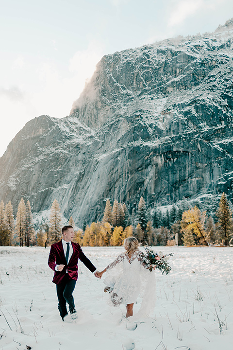  winter Yosemite wedding with the groom in a burgundy velvet tuxedo 