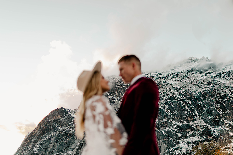  winter Yosemite wedding with the groom in a burgundy velvet tuxedo