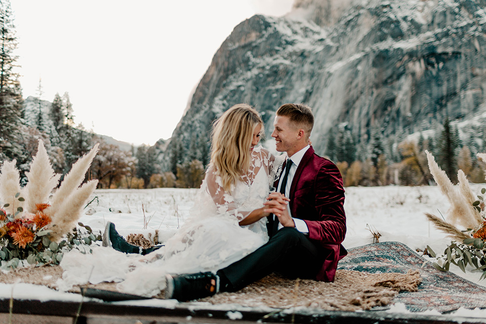  winter Yosemite wedding with the groom in a burgundy velvet tuxedo