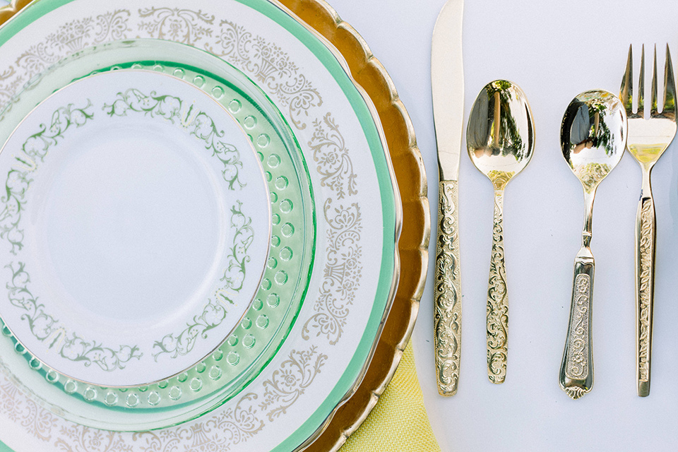  70s inspired wedding with orange and caramel tones with the bride in a lace gown and the groom in a caramel suit - flatware 