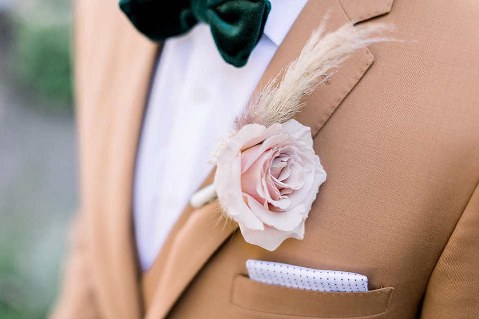  70s inspired wedding with orange and caramel tones with the bride in a lace gown and the groom in a caramel suit - groom 