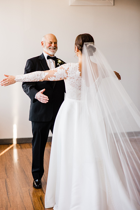  burgundy and green wedding with winter vibes – bride with her father and bridesmaids 