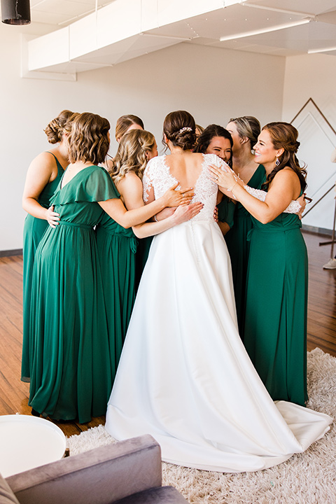  burgundy and green wedding with winter vibes – bride with her father and bridesmaids 