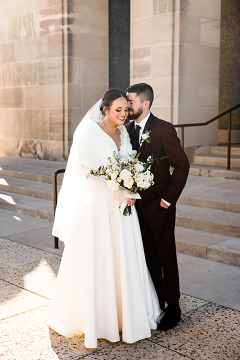  burgundy and green wedding with winter vibes – couple on the steps 