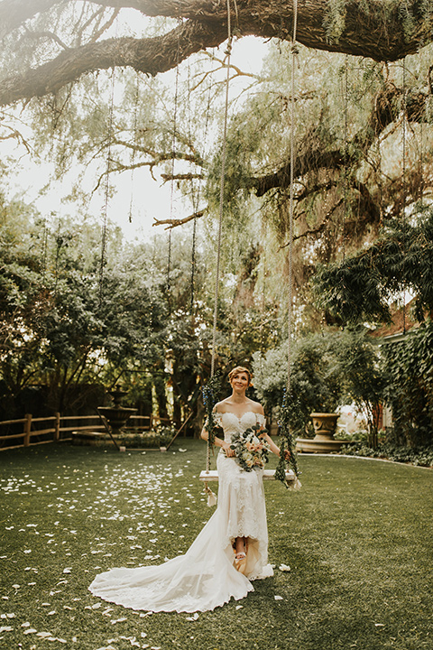  a romantic rustic garden wedding with the groom in a blue suit and floral tie and the bride in a lace gown - bride 