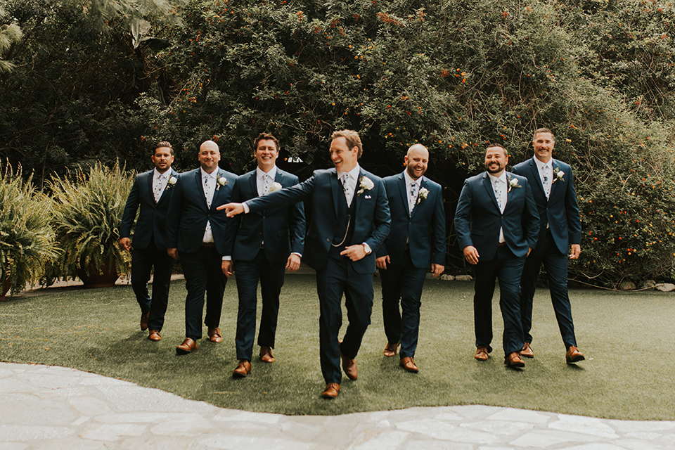  a romantic rustic garden wedding with the groom in a blue suit and floral tie and the bride in a lace gown - groomsmen 
