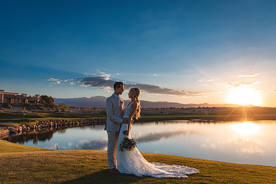  a tan and teal wedding with rustic chic details – couple at sunset 