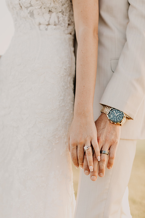  a tan and teal wedding with rustic chic details – couple embracing 