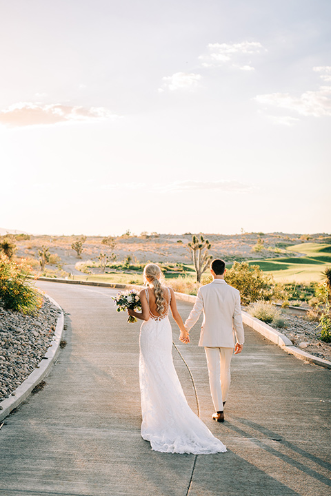  a tan and teal wedding with rustic chic details – couple embracing 