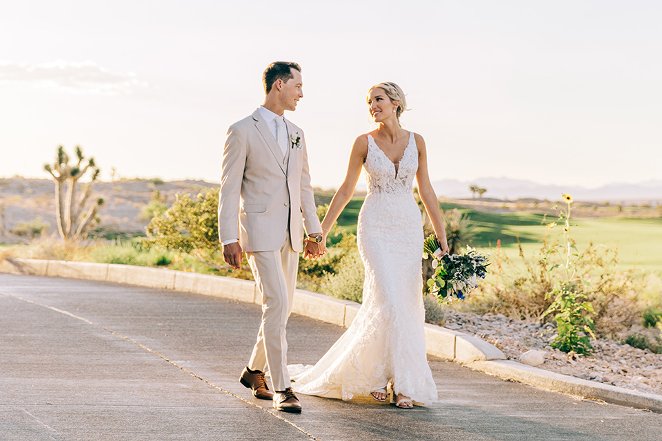  a tan and teal wedding with rustic chic details – groomsmen at ceremony 