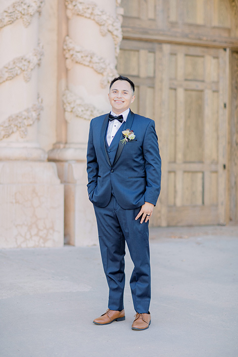  classic and modern balboa wedding with the groom in a navy shawl – groom 