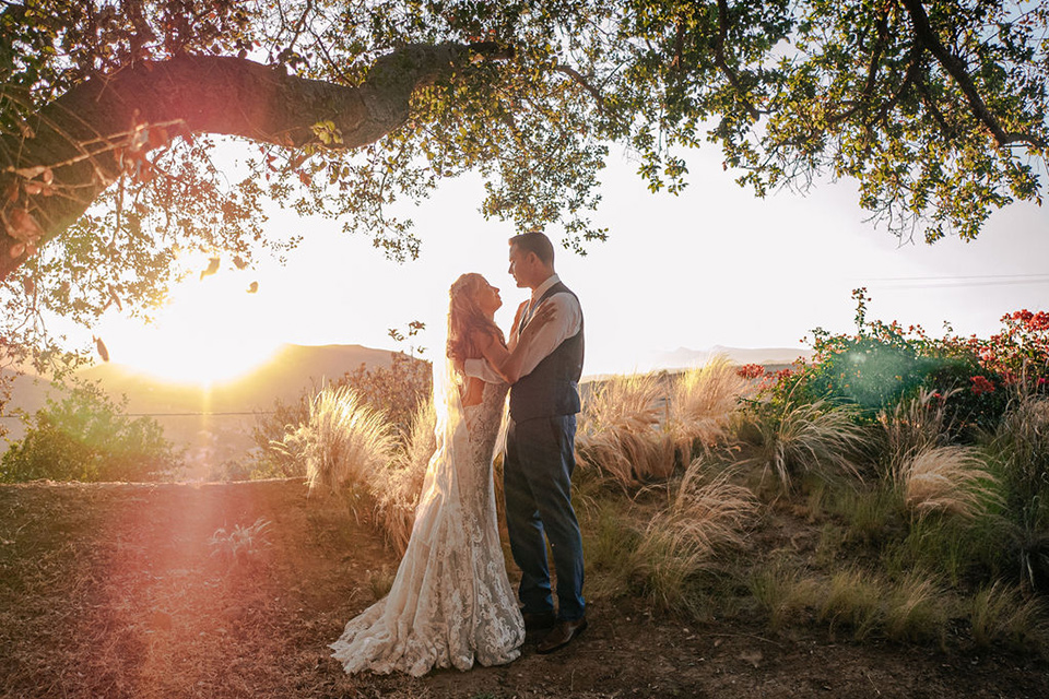  a romantic blush and blue wedding with garden details - couple at sunset 