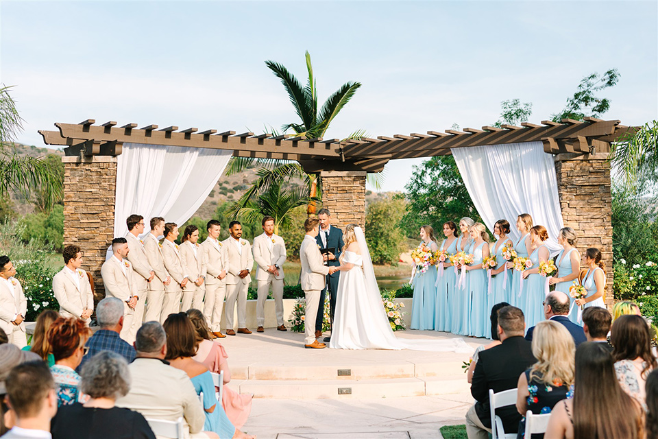  a beachy wedding with bold pastel colors and fun details - ceremony 