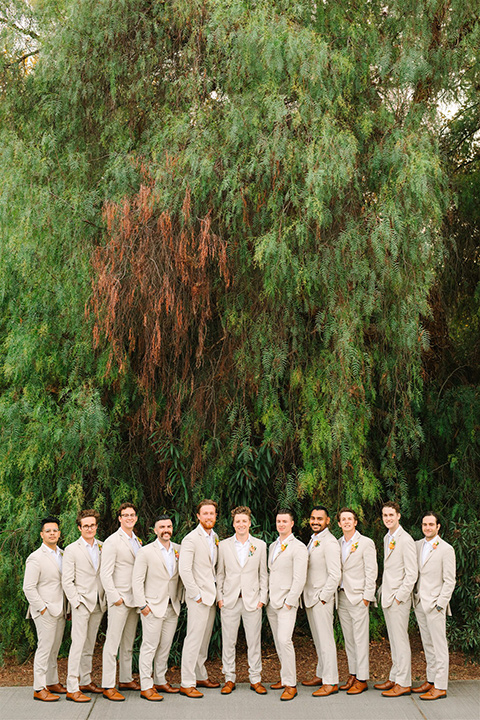  a beachy wedding with bold pastel colors and fun details - groomsmen 
